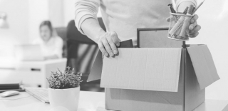 man-packing-up-desk