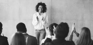 woman-speaking-to-applause