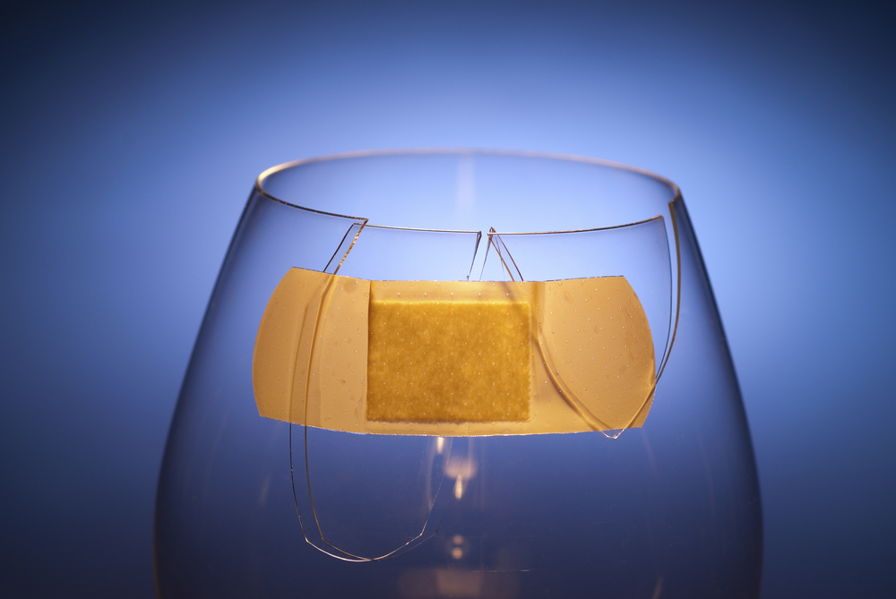 bandaid on glass shutterstock 148052594